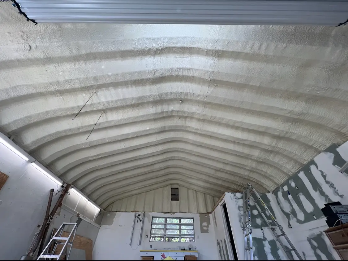 Spray polyurethane foam applied to the underside of a metal roof deck in Rockport